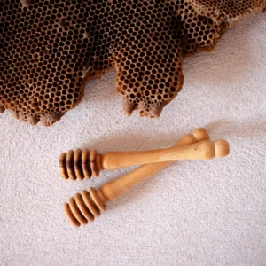 Handcrafted in Bethlehem, our Olive Wood Honey Dipper brings Palestinian heritage to your kitchen. Made from ancient olive trees, each piece is unique. Perfect for honey lovers.