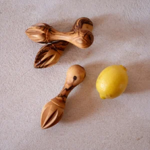 andcrafted in Bethlehem, our Olive Wood Lemon Reamer brings Palestinian heritage to your kitchen. Made from ancient olive trees, each piece is unique. Perfect for culinary enthusiasts.