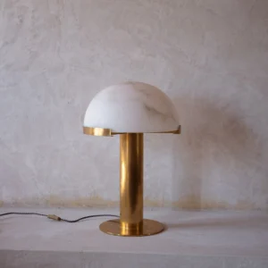 Beautiful table lamp featuring brass and marble. Modern design meets timeless elegance inspired by Art Deco. Perfect for any room.