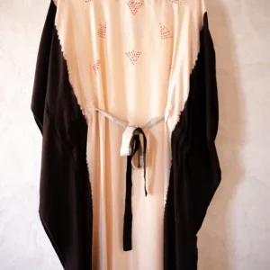 Shop the Izmir Black Silk Kaftan by Sonali Raman, featuring luxurious 100% silk and traditional Bandhej craftsmanship. Handcrafted elegance and mindful fashion.