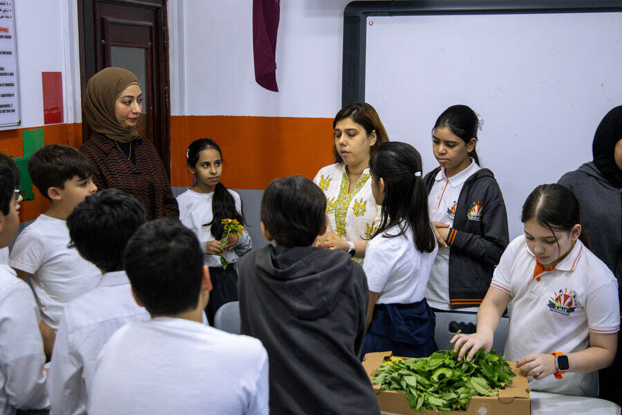 Students sorting the day's harvest back at school