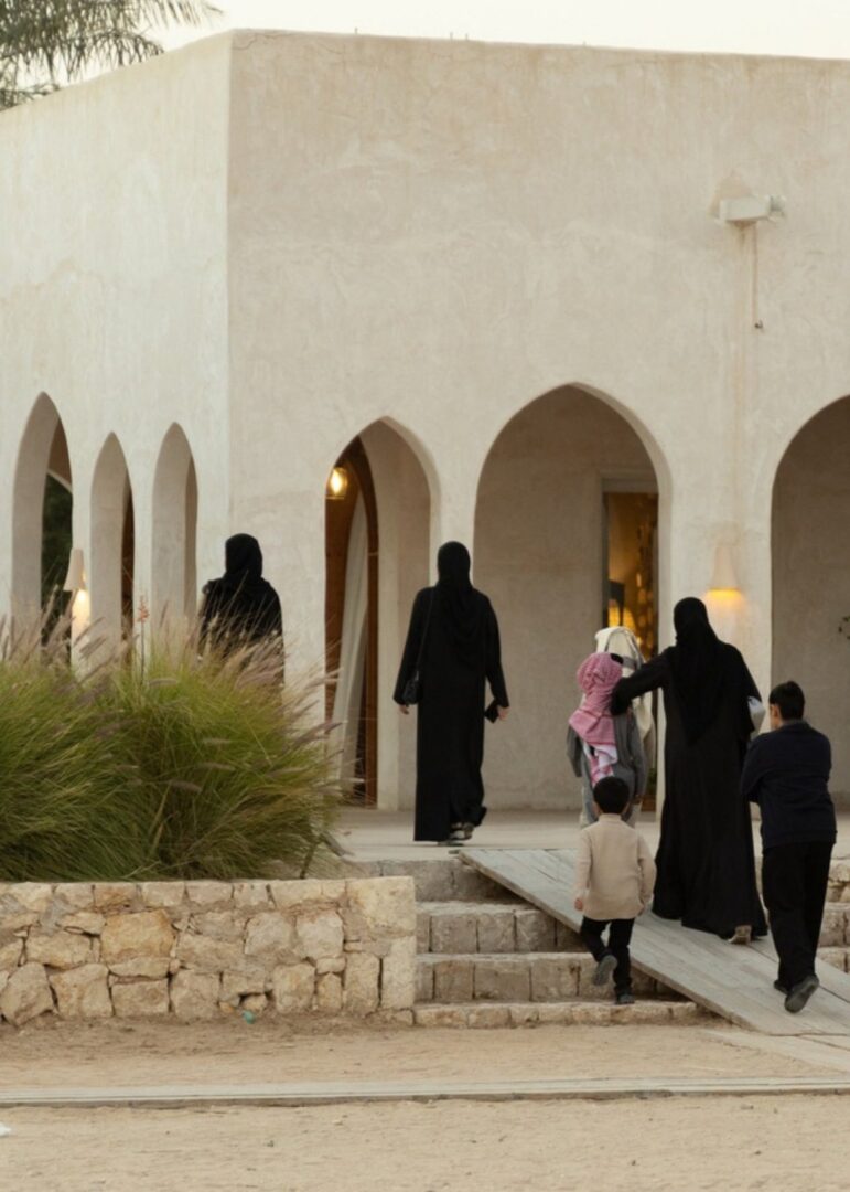 Guests arriving at an arched farm building at Heenat Salma Farm