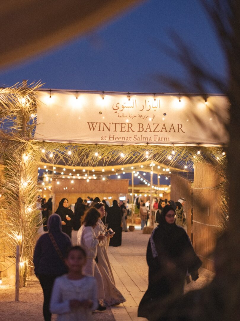 The lantern-lit Winter Bazaar entrance at night