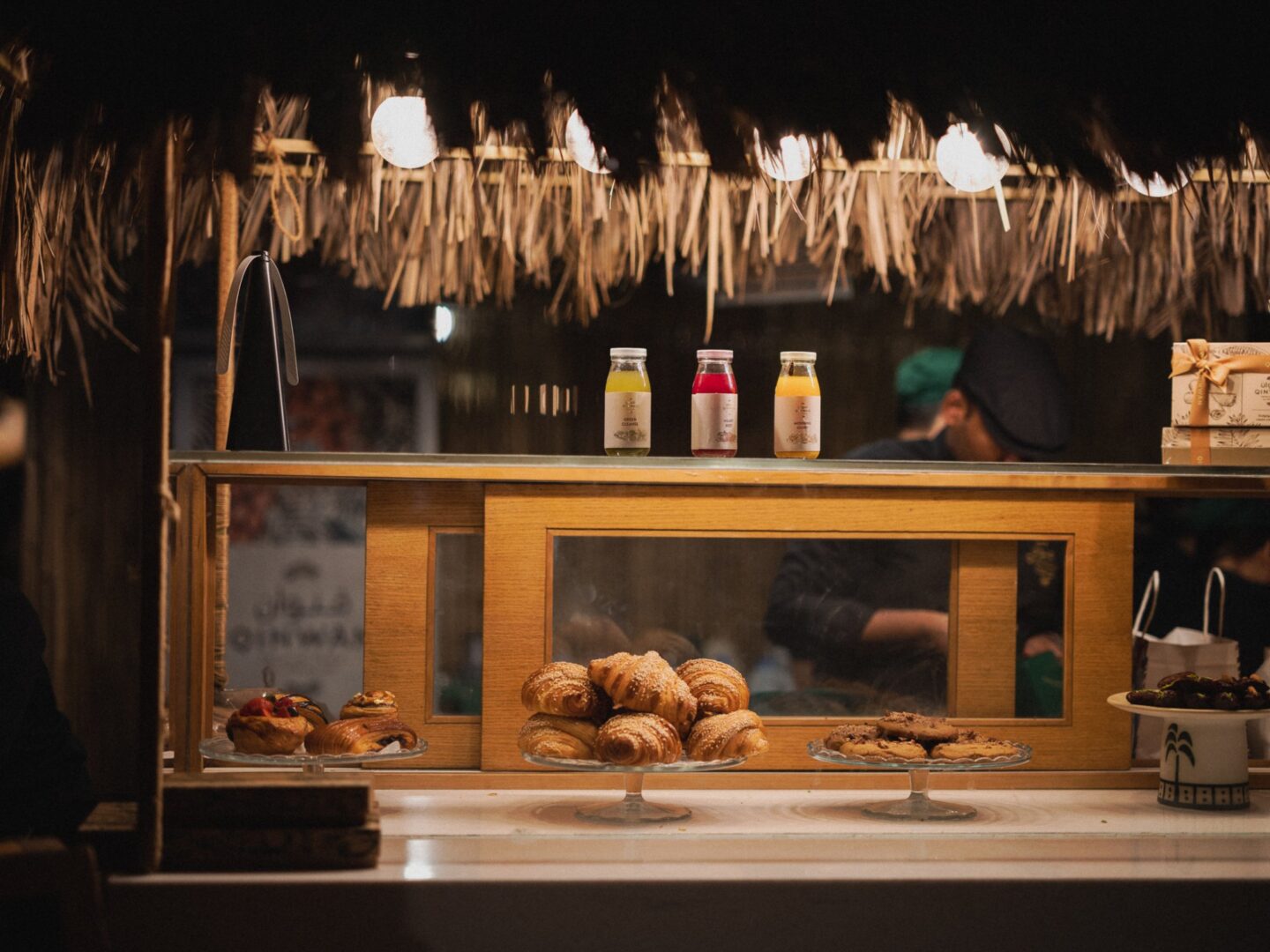 A counter of freshly baked bites lit for the evening